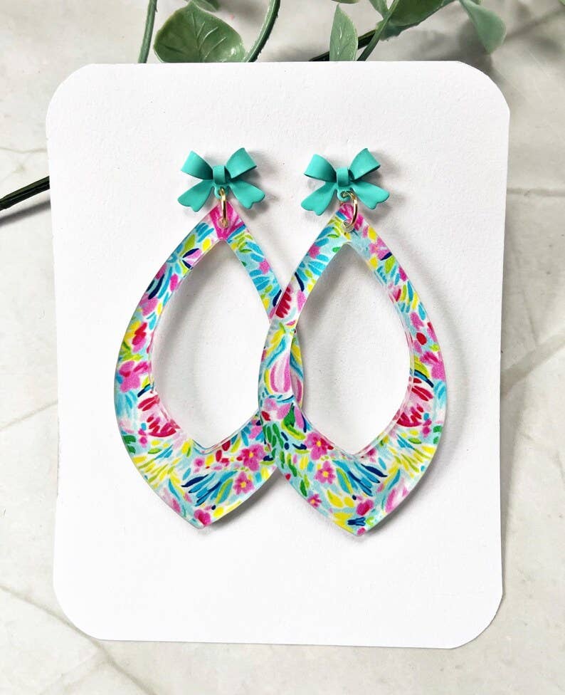 4190. Floral Teardrop Dangle Earrings: Acrylic Flower Print with Teal Bow