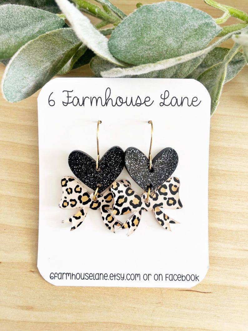 4185. Leopard Heart Earrings: Black glitter hearts, leopard bow, Gold Hooks