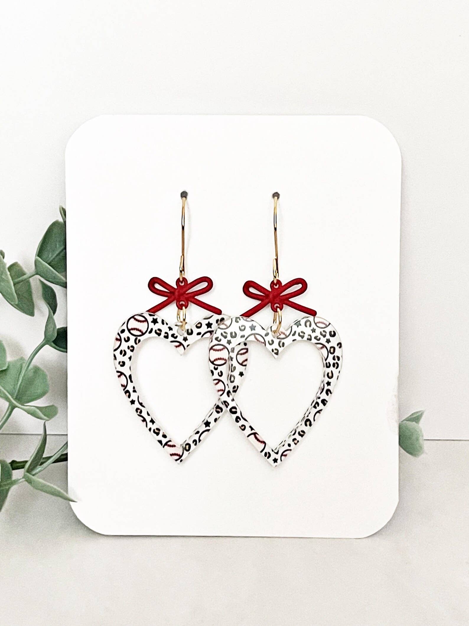 4181. Baseball Earrings: Acrylic Heart Dangles with Red Bow