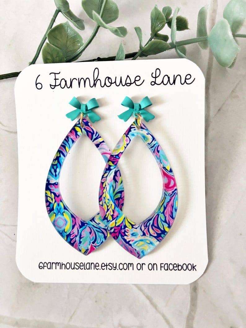 4188. Floral Teardrop Dangle Earrings: Acrylic Flower Print with Teal Bow
