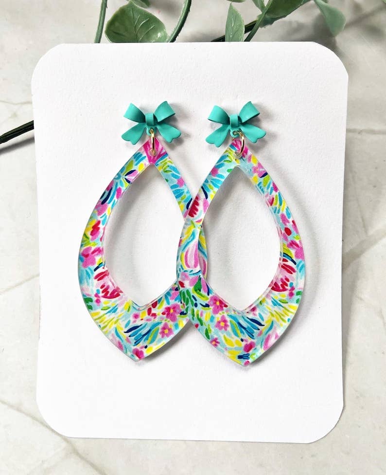 4190. Floral Teardrop Dangle Earrings: Acrylic Flower Print with Teal Bow