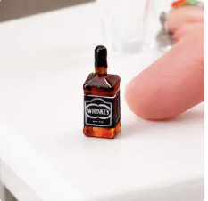 8300. 1/4" W x 3/4" H Miniature Whiskey Bottle